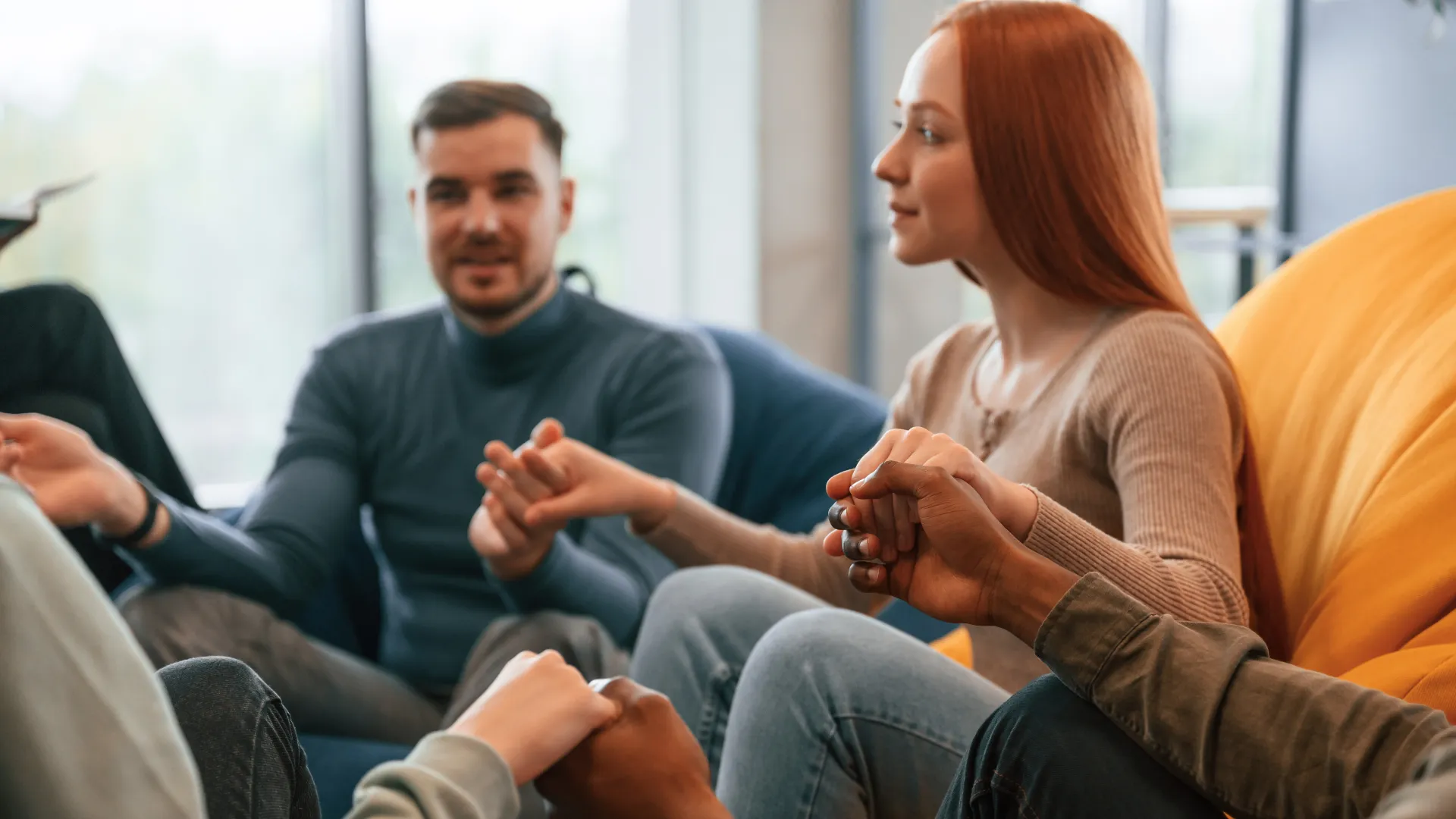 sitting-and-holding-each-other-by-hands
